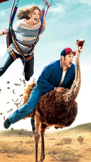 A man rides an ostrich in the desert while a woman swings nearby in a colorful harness, HD Phone Wallpaper