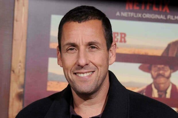 Adam Sandler smiles warmly at a promotional film event wearing a black coat, HD Desktop Wallpaper
