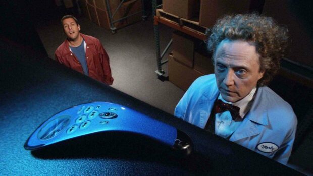 Adam Sandler with another man standing behind a strange blue gadget in a dimly lit room, HD Desktop Wallpaper