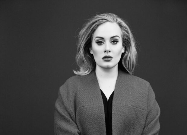 Adele shows a serious expression in a classic black and white portrait, HD Desktop Wallpaper