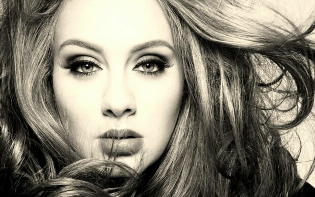 A close up portrait of Adele with flowing hair and expressive eyes, HD Desktop Wallpaper