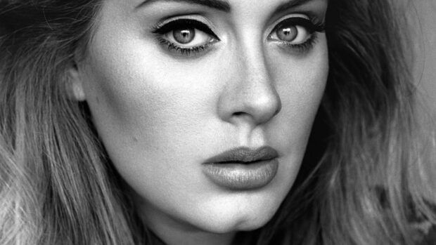 A close up of Adele showing an intense gaze and detailed facial features in black and white, HD Desktop Wallpaper