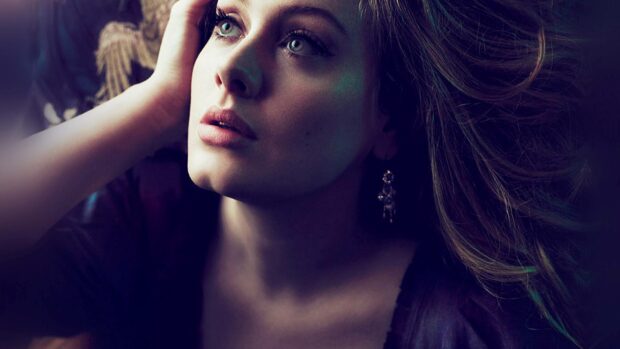 A close up portrait of Adele with a thoughtful expression and flowing hair, HD Desktop Wallpaper