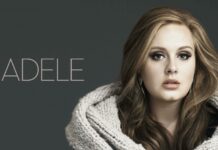 A close up portrait of Adele wearing a warm knitted shawl against a gray background, 2K Desktop Wallpaper