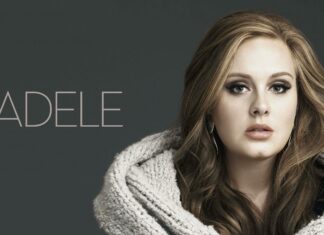 A close up portrait of Adele wearing a warm knitted shawl against a gray background, 2K Desktop Wallpaper