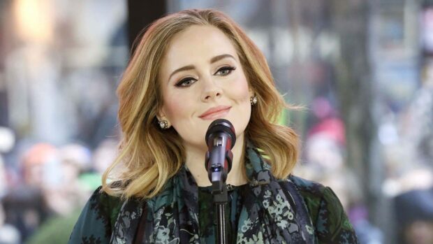 Adele expressing emotions during a performance, HD Desktop Wallpaper