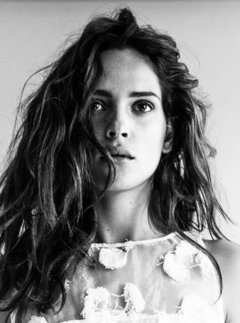 Adria Arjona Black and White Portrait Wallpaper with Natural Hair and Soft Expression