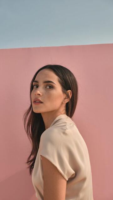 Adria Arjona Portrait in Soft Light Minimalist Pink Background Wallpaper