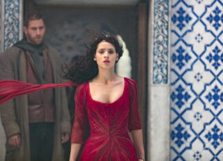 Adria Arjona Wallpapers Stunning Red Dress Scene with Blue Tile Background