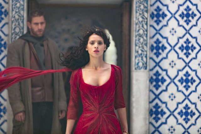 Adria Arjona Wallpapers Stunning Red Dress Scene with Blue Tile Background