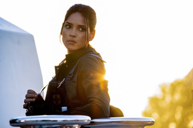 Adria Arjona intense look in tactical gear sunset wallpaper