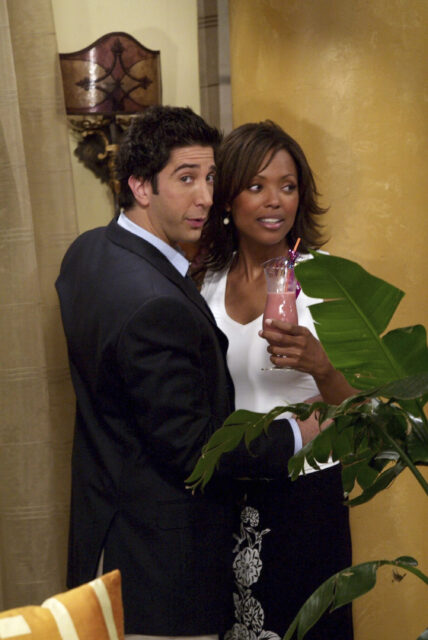 Aisha Taylor Enjoying A Drink Scene Wallpaper For Fans