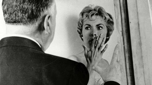 A dramatic scene from an Alfred Hitchcock film with a woman looking shocked, HD Desktop Wallpaper