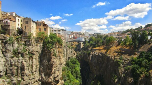 The Algeria canyon view with city buildings and a bridge under a blue sky with clouds, HD Desktop Wallpaper