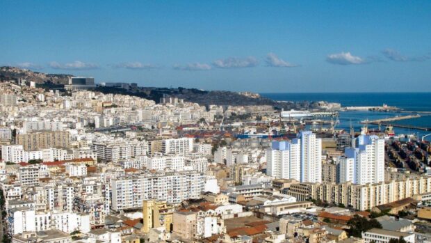 A panoramic view of Algeria city showing buildings, hills, and the Mediterranean Sea, HD Desktop Wallpaper