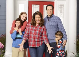 American Housewife Cast In Front Of Red Door – TV Series Wallpaper