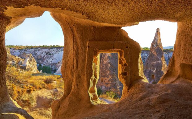 The ancient cave openings in Cappadocia reveal unique rock formations and natural landscape, HD Desktop Wallpaper