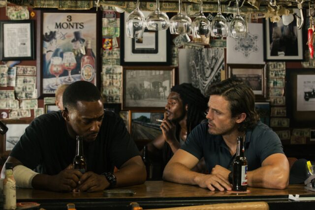 Anthony Mackie In A Bar Scene Wallpaper Conversation Setting