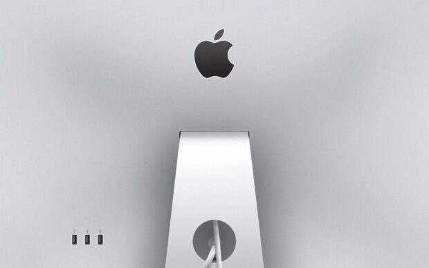 The Apple logo is displayed on the back of a silver iMac computer, HD Desktop Wallpaper