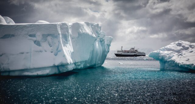 Arctic Ocean Icebergs And Expedition Ship Wallpaper In Icy Waters