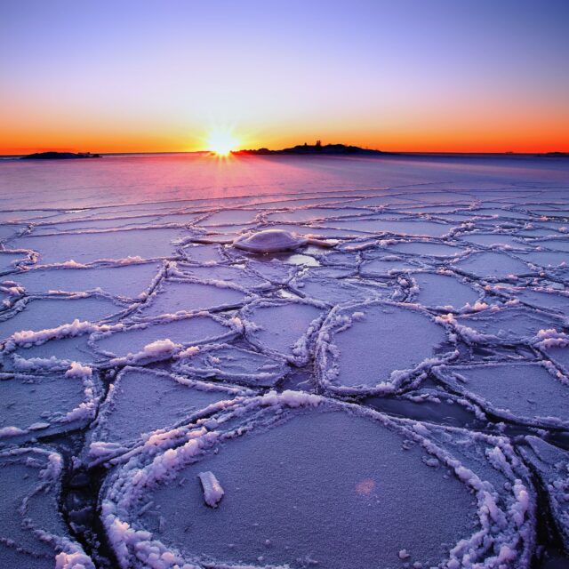 Arctic Ocean Sunrise Over Frozen Ice Patterns Stunning Winter Landscape Wallpaper
