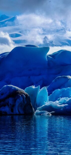The Arctic ice formations are surrounded by calm water and misty mountains, HD Phone Wallpaper