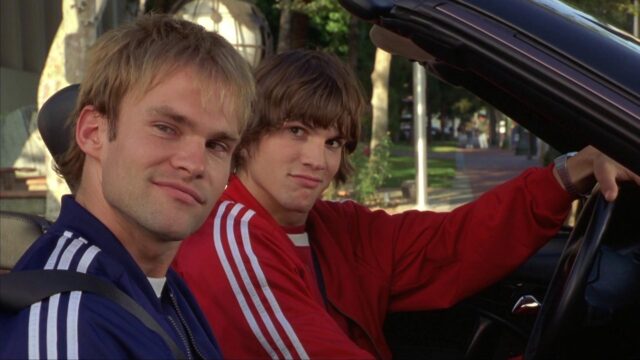 Ashton Kutcher In A Classic Car Scene With A Friend Wearing Sporty Jackets Wallpapers