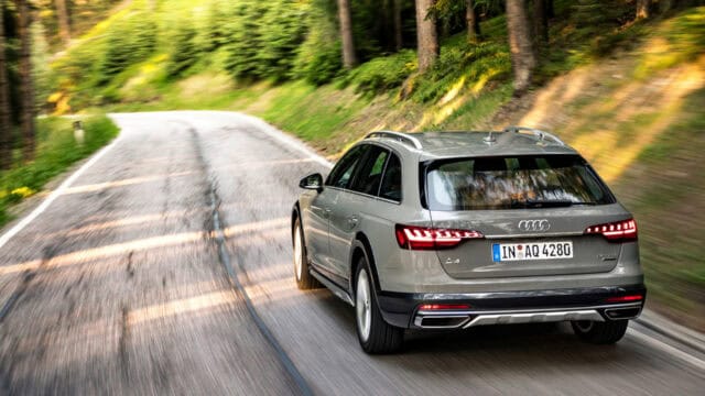 Audi A4 Allroad Navigating Scenic Forest Road Wallpaper