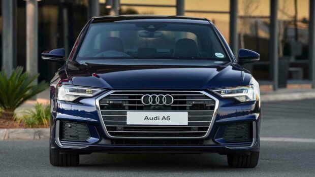The Audi A6 showcases a sleek front grille and sharp LED headlights in a dark blue finish, HD Desktop Wallpaper PC Wallpaper