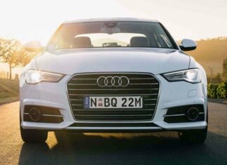 A white Audi A6 is parked on a road with the sun shining behind it, HD Desktop Wallpaper