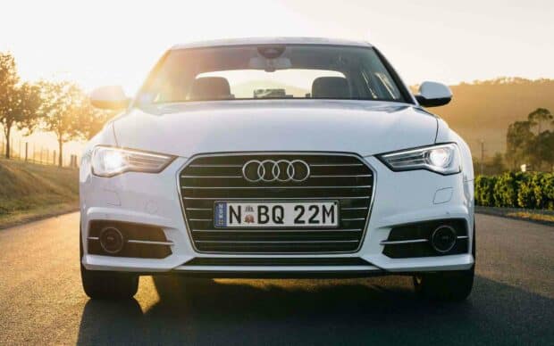 A white Audi A6 is parked on a road with the sun shining behind it, HD Desktop Wallpaper