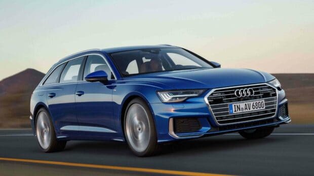 A blue Audi A6 is driving fast on a highway with a blurred background, 4K Desktop Wallpaper