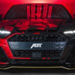 Audi S6 ABT Front View Wallpaper With Red And Black Geometric Design Lighting