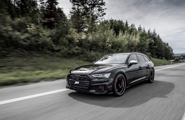 Audi S6 Black ABT Tuning Driving On Open Road With Forest Background Wallpaper
