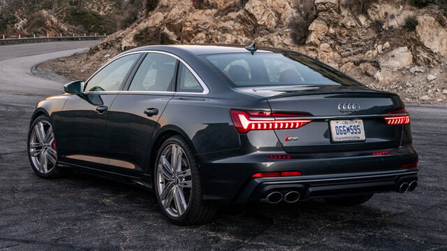 Audi S6 Rear View On Mountain Road Scenic Wallpaper