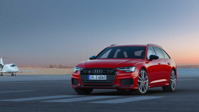 Audi S6 Red Sports Wagon Parked On Airport Runway At Sunset Wallpaper