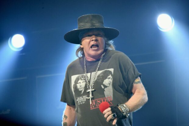 Axl Rose is performing on stage with intense expression, HD Desktop Wallpaper
