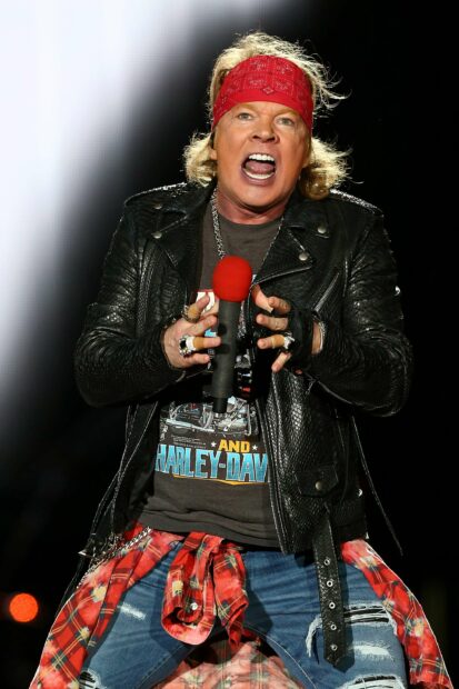 Axl Rose passionately singing during a concert performance, 2K Mobile Wallpaper