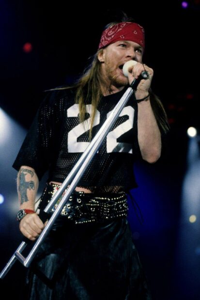Axl Rose is singing passionately during a live concert performance, HD Desktop Wallpaper
