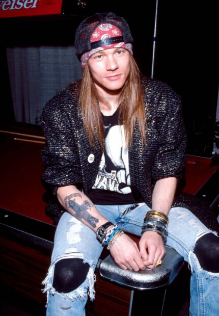 A young man wearing a bandana and ripped jeans with Axl Rose wallpapers tattoo on his arm, 2K Mobile Wallpaper