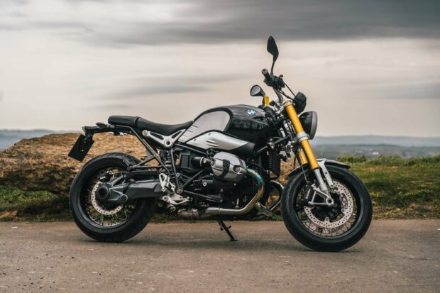 BMW R Nine T motorcycle is parked on a road with a scenic background, HD Desktop Wallpaper
