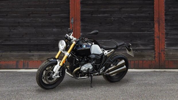 A black BMW R Nine T parked in front of a rustic wooden garage door, HD Desktop Wallpaper