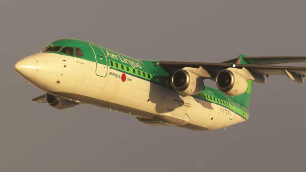 A Bae Avro airplane with Aer Lingus livery is flying against a clear sky, 2K Desktop Wallpaper