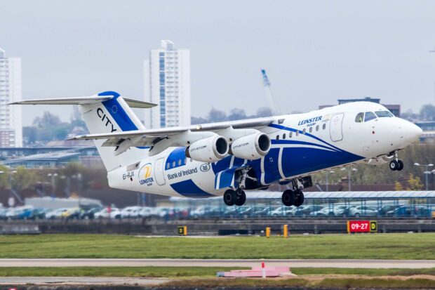 A Bae Avro aircraft with blue and white colors is taking off from the runway, HD Desktop Wallpaper