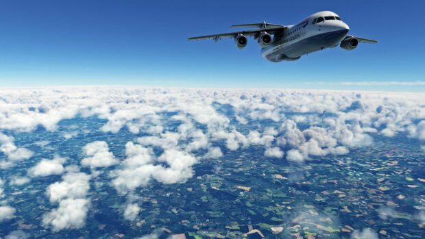 A Bae Avro plane is flying high above a landscape covered with clouds, 2K Desktop Wallpaper