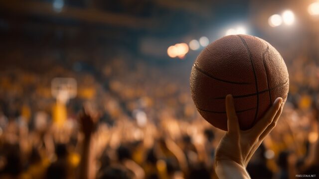 Basketball Background, An Intense Close Up Of A Basketball Spinning On A Finger With A Blurred Crowd In The Background