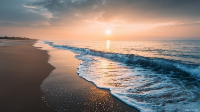 Best Background HD For PC, A Tranquil Beach Scene With Gentle Waves Rolling Onto The Shore At Sunrise