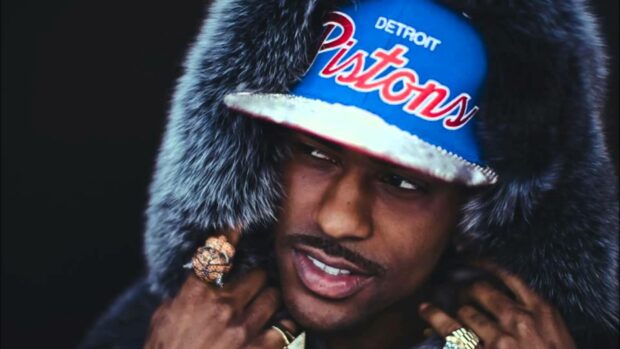 Big Sean wearing a Detroit Pistons cap and a fur hood, HD Desktop Wallpaper