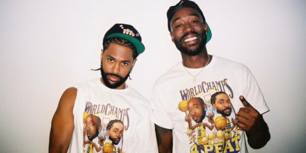 Two men wearing matching World Champs t shirts featuring Big Sean artwork, HD Desktop Wallpaper
