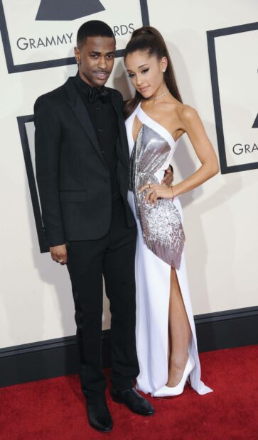 Big Sean is standing on a red carpet with a woman in a white dress at the Grammy Awards, HD Mobile Wallpaper